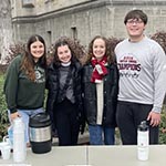Four students posing together